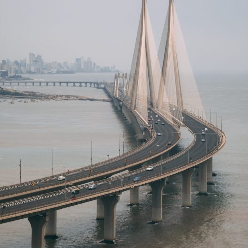 A high angle shot of Bandra Worli sealink in Mumbai enveloped with fog